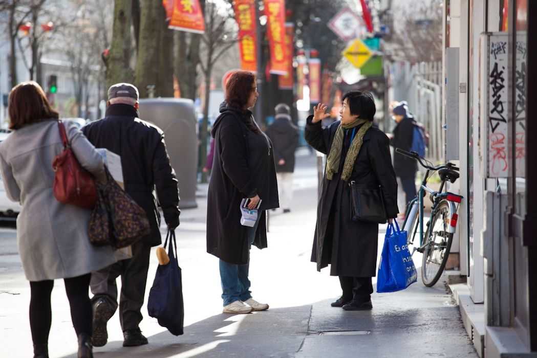 Two women talk on the Gandon street in Paris' 13th arrondissement