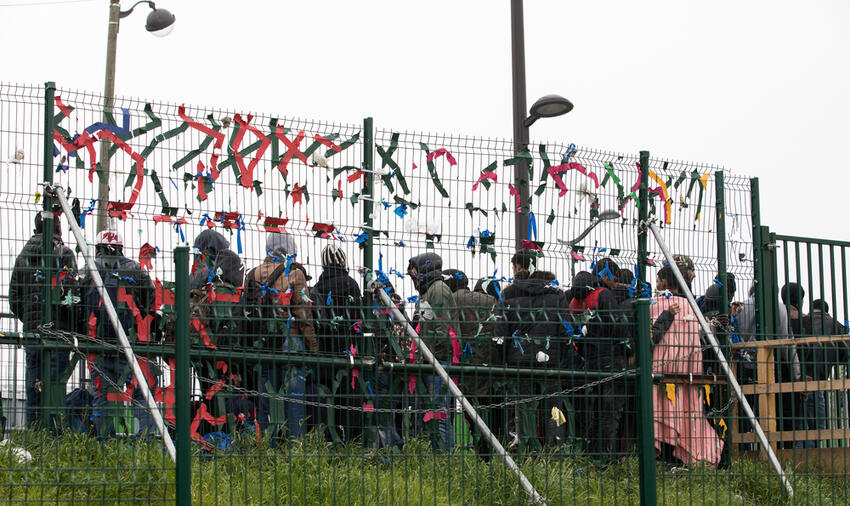 Migrants waiting, north of Paris, 05/2017. Harriet Hadfield (via Shutterstock)